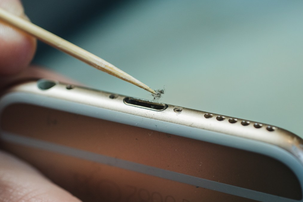 Take a few minutes to remove dirt from your phone's charging port.