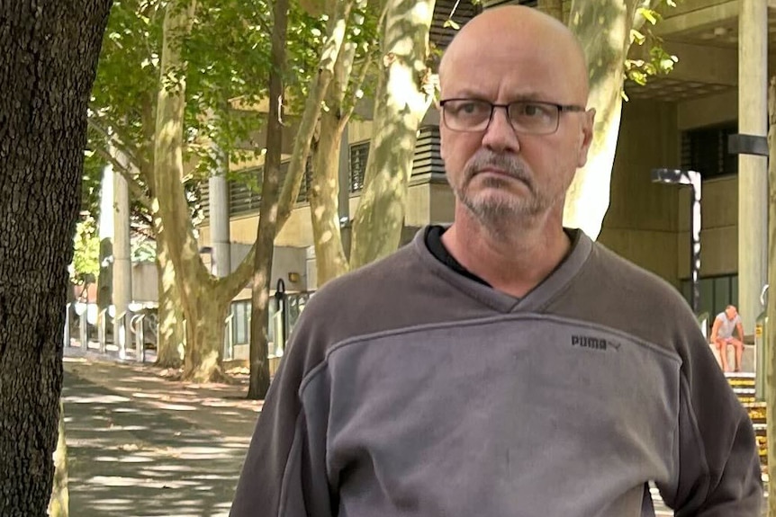 barrister Mark Dennis leaving a police station in sydney