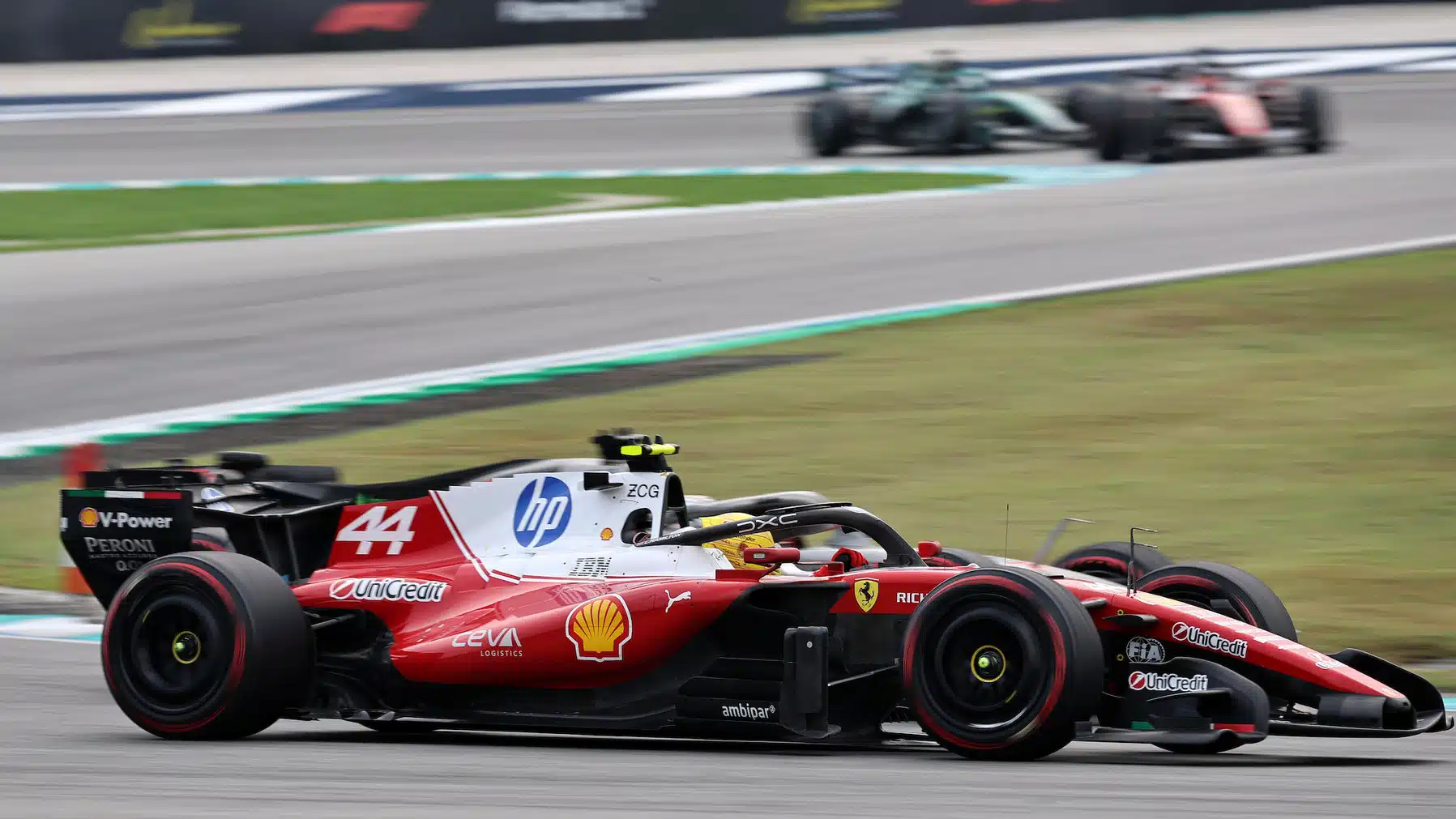 Lewis Hamilton (Ferrari) and Nico Hulkenberg (Audi) side by side during the 2026 Bahrain Grand Prix