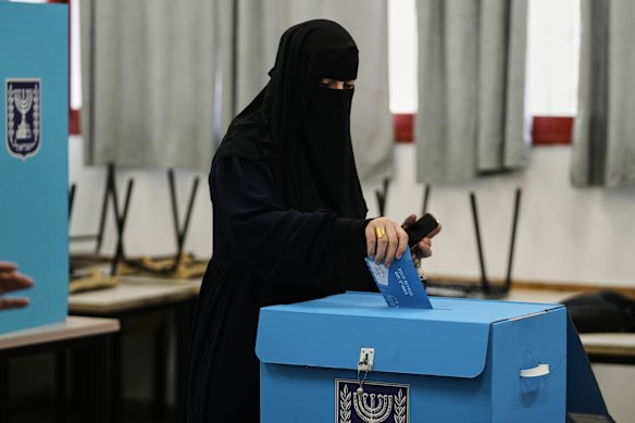 A Palestinian citizen of Israel casts her ballot in Umm al-Fahm.