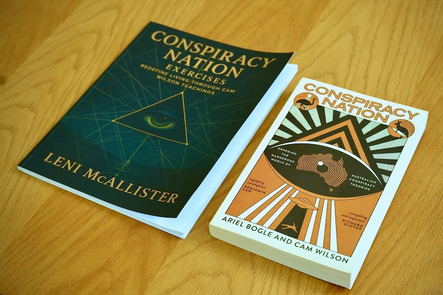 Two books sitting side by side on a table - both are titled very similarly