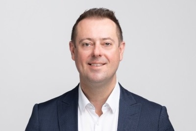Matthew Starkey's LinkedIn profile picture. He is smiling in a casual sports jacket