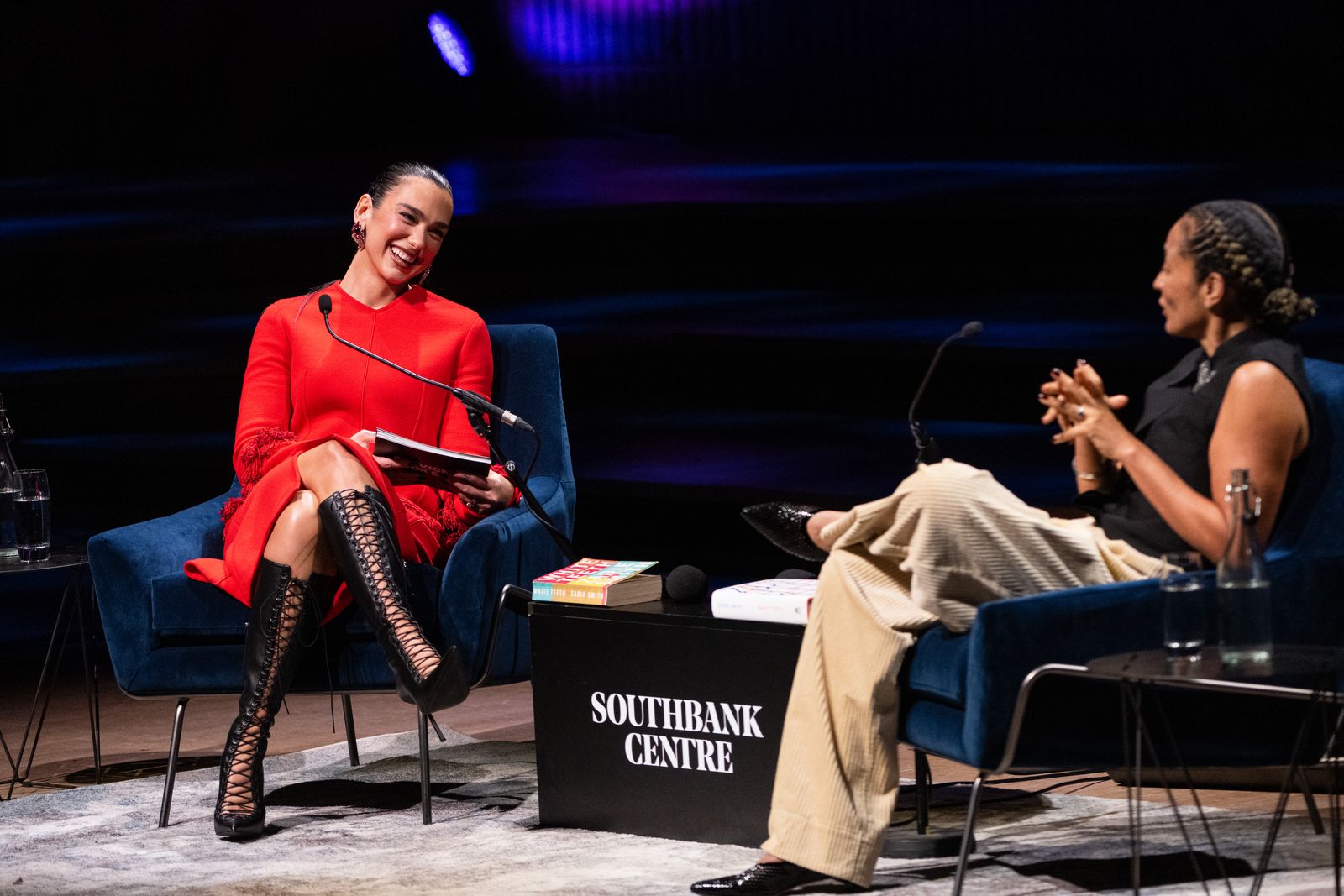 LONDON ENGLAND OCTOBER 24 Dua Lipa and Zadie Smith onstage during Dua Lipa In Conversation With Zadie Smith at the...