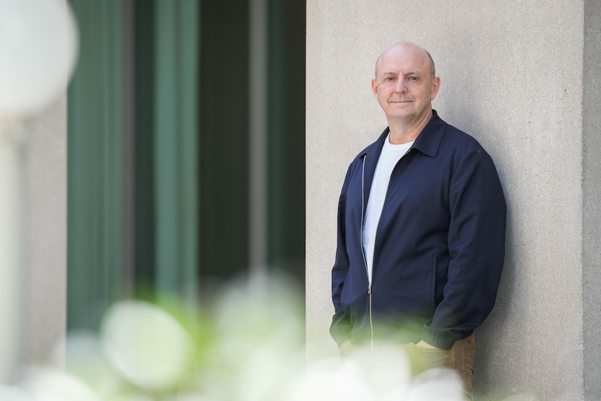 Richard Denniss wears a dark jacket.