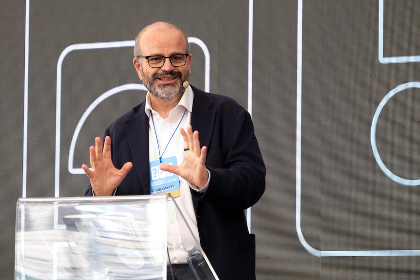 A man standing at a lectern giving a speech.