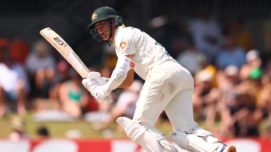 Australian batter Marnus Labuschagne plays a ball off his legs in a match.