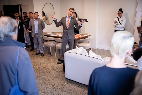 Auctioneer Jake Moore extols the virtues of warehouse conversions to a captive audience.