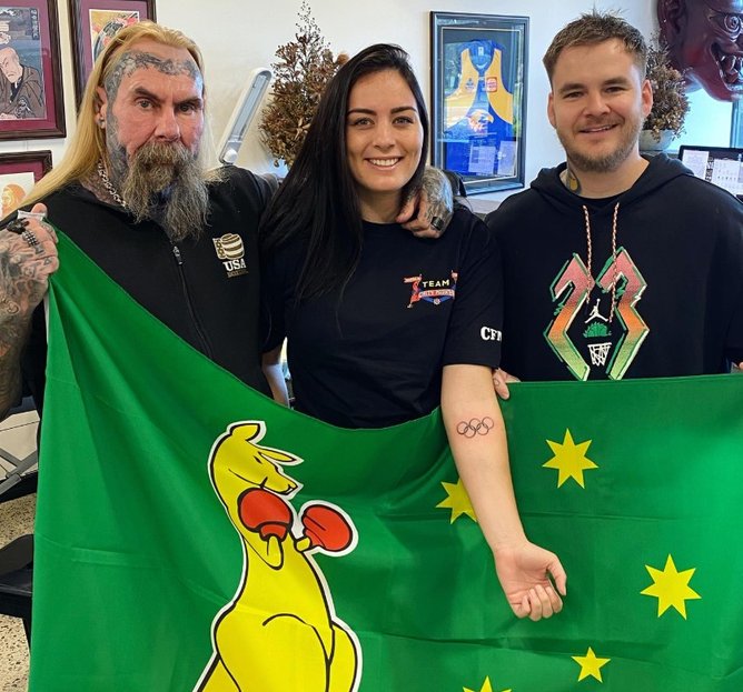 Caitlin Parker with coach Foxy and tattoo artist Jackson May. 
