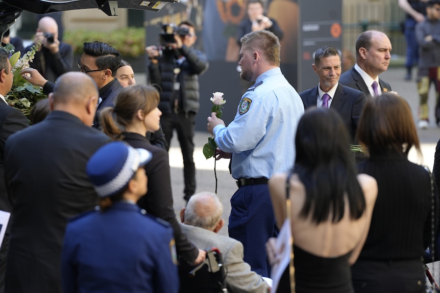 Mia Lay's partner Daniel Vasquez holds a rose.