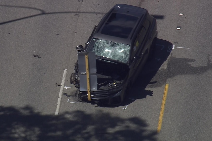 A black car's windscreen is smashed after a crash