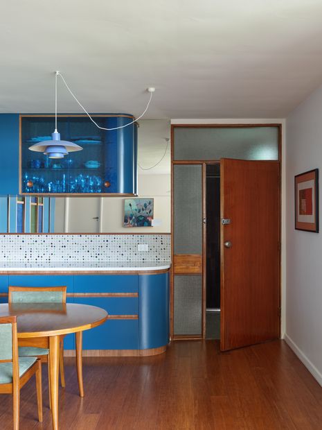 Joinery continues into the living and dining space to provide additional storage. Artworks: Adrienne Williams.