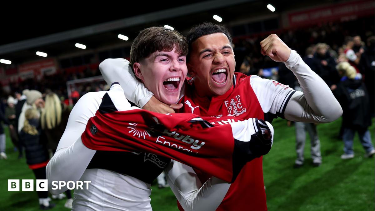 Fleetwood's players celebrate after beating Premier League champions Arsenal in the League Cup fourth round