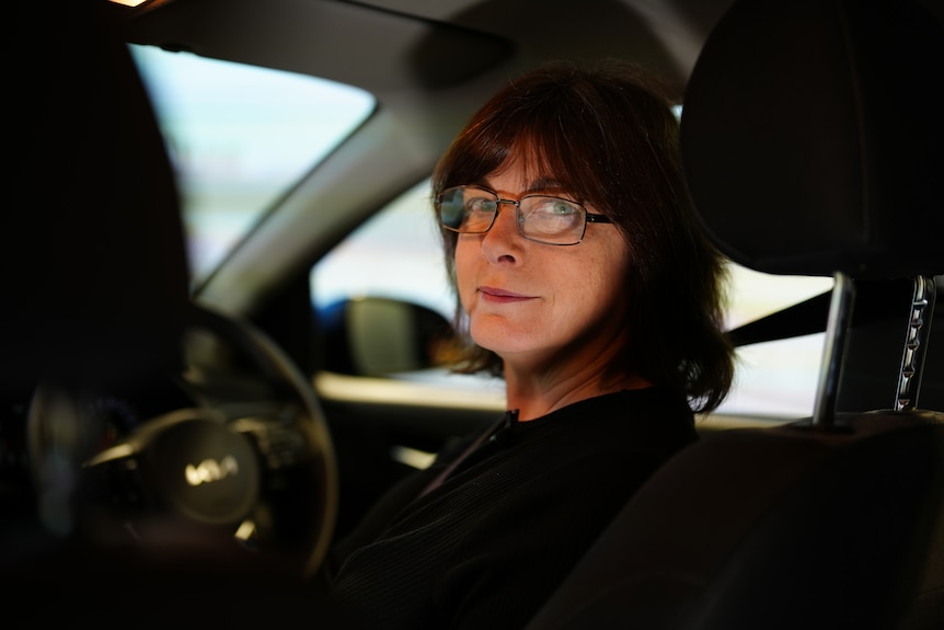 Portrait of a women seated inside a car