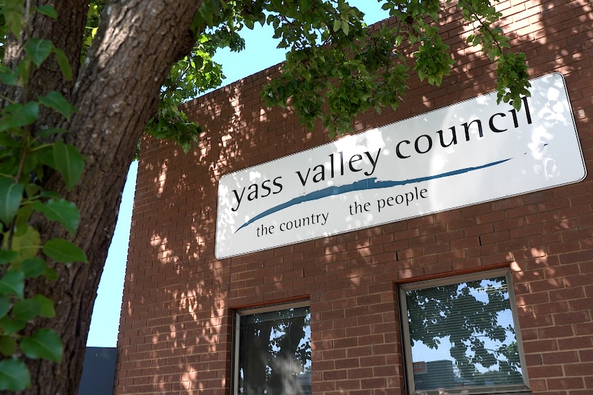 sign saying yass valley council on a red brick building