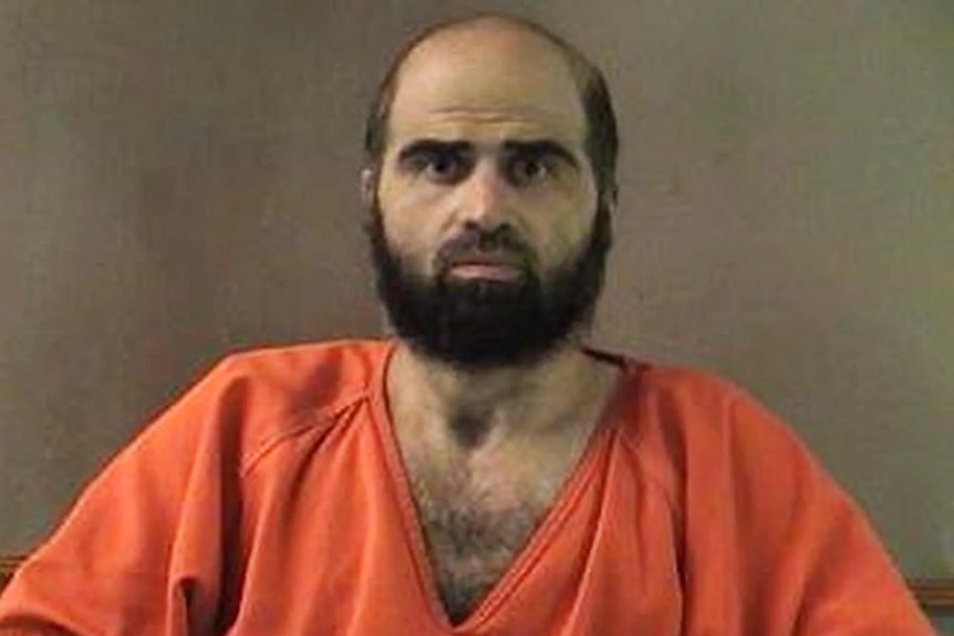 Nidal Hasan wears an orange T-shirt.