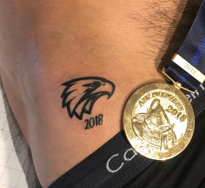 Some of the players from the West Coast Eagles’ 2018 premiership team got commemorative ink from Jackson May (pictured: Don Sheed’s tattoo). 
