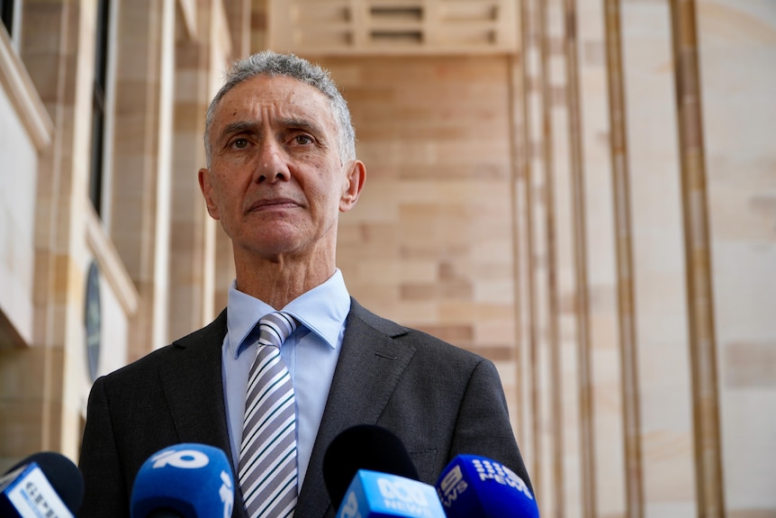 Up shot of Tony Buti outside Parliament