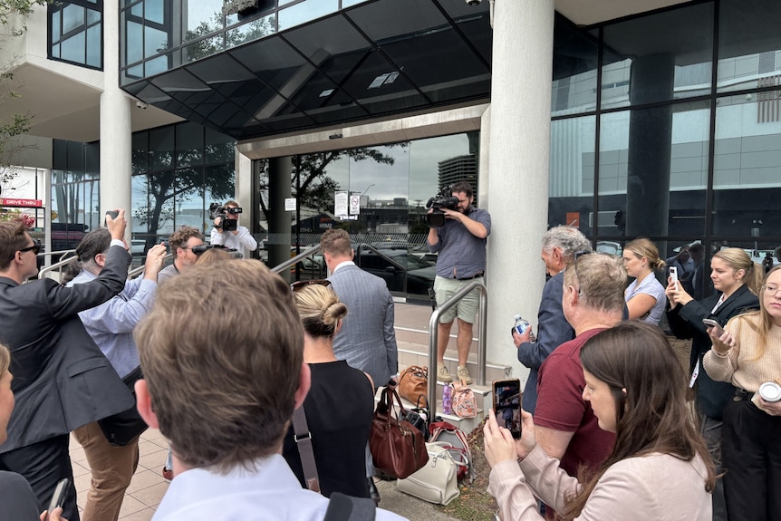 A crowd of journalists and camera operators outside Maroochydore Magistrates Court