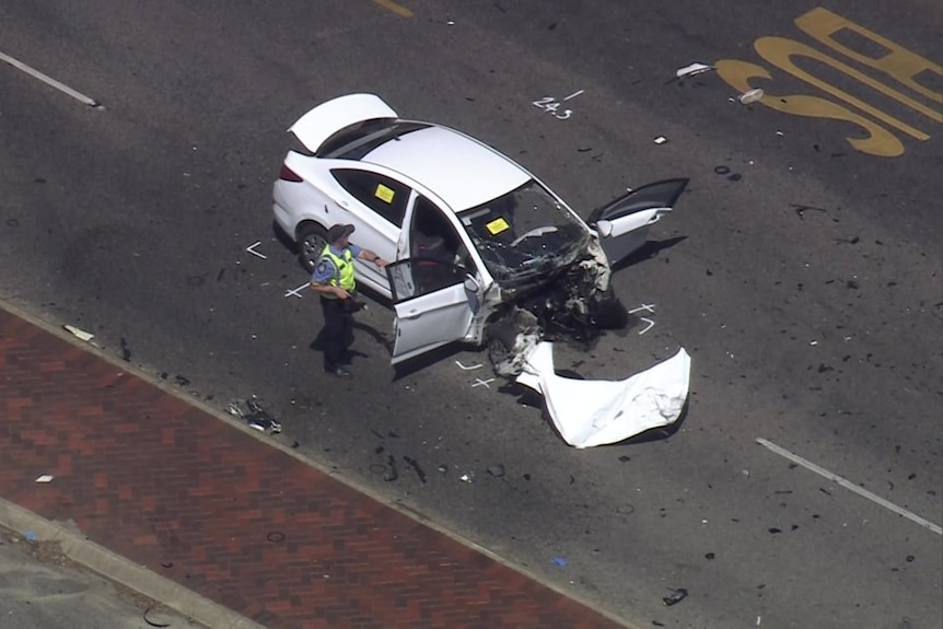The front of a white car has been ripped off in a crash pictured from above
