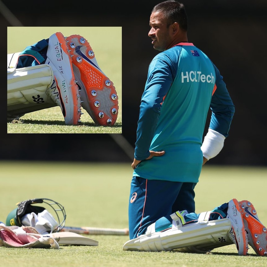 Usman Khawaja leans on his knees on a grass field. Inset close up of shoes with pen writing.