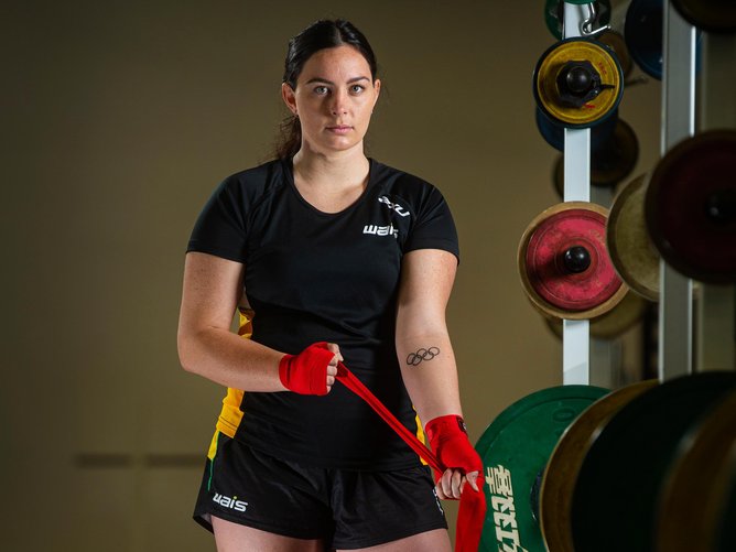 Olympic boxer Caitlin Parker showing off her tattoo, done by Jackson May. 
