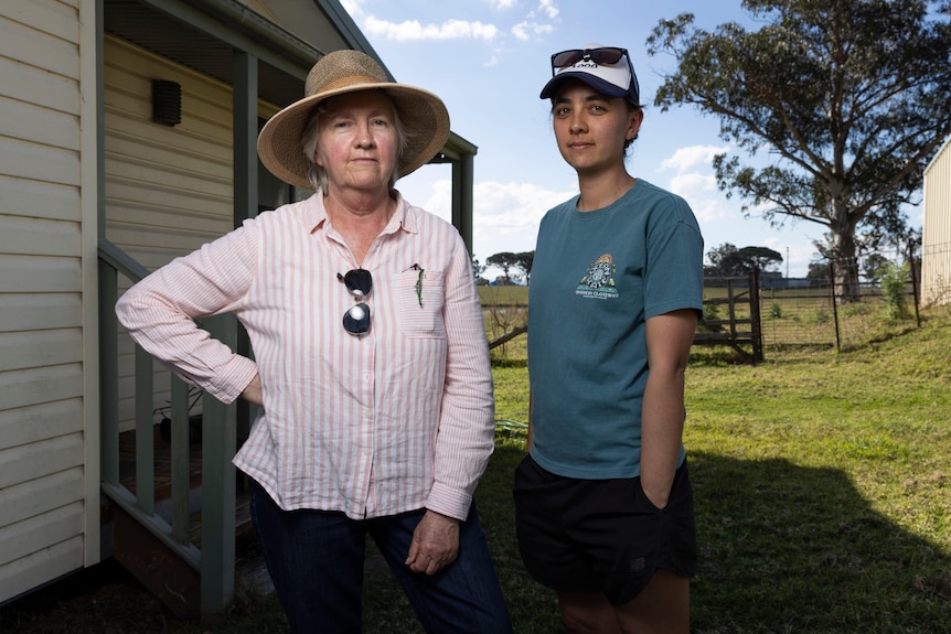 Carolyn Wong and Katherine Wong standing in their garden