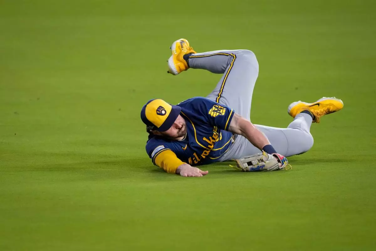 Milwaukee Brewers center fielder Garrett Mitchell catches a fly out hit by Los Angeles Dodgers second baseman Tommy Edman during the fifth inning of Game 3 of baseball's National League Championship Series between the Milwaukee Brewers and the Los Angeles Dodgers, Wednesday, Oct. 14, 2026, in Los Angeles. (AP Photo/Mark J. Terrill)
