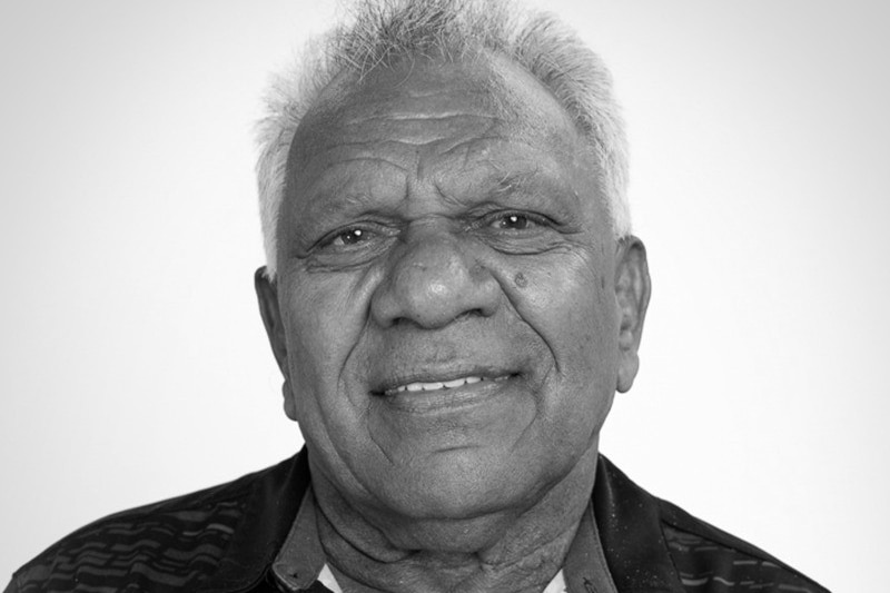 Black and white photo of a man smiling