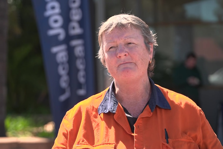 A Whyalla steelworker in an orange top.