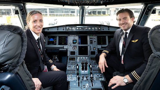 Captain Taryn Lloyd and first officer Jay Bayliss on the refitted A321 at Western Sydney International Airport.