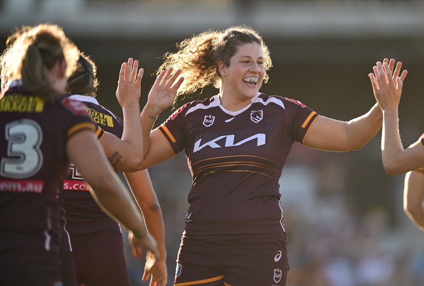 Chelsea Lenarduzzi celebrates with her team mates.
