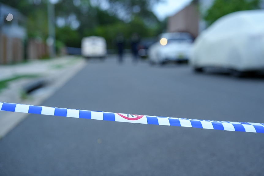 NSW Police tape in non-identifiable street.
