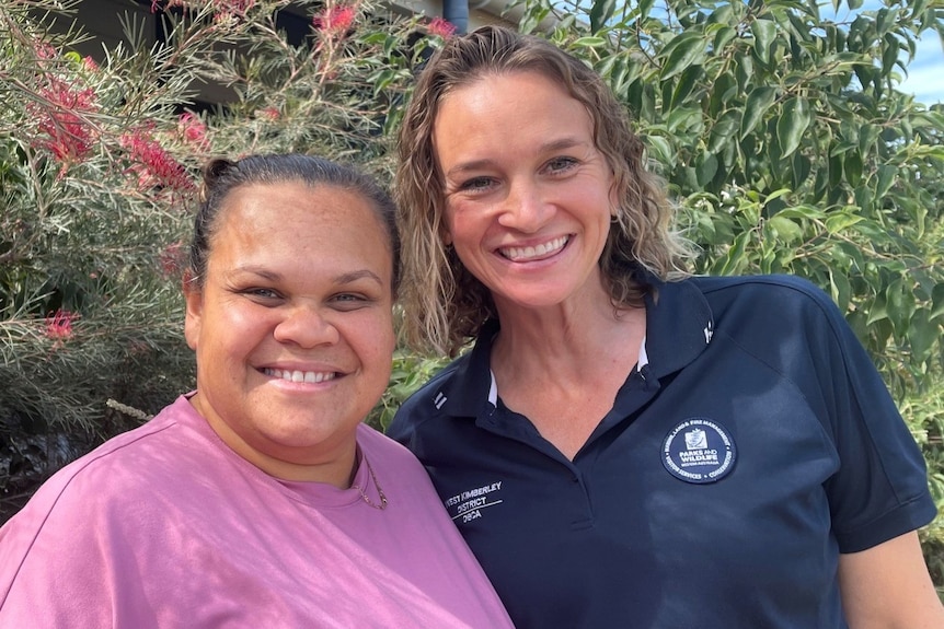 two women smiling to camera