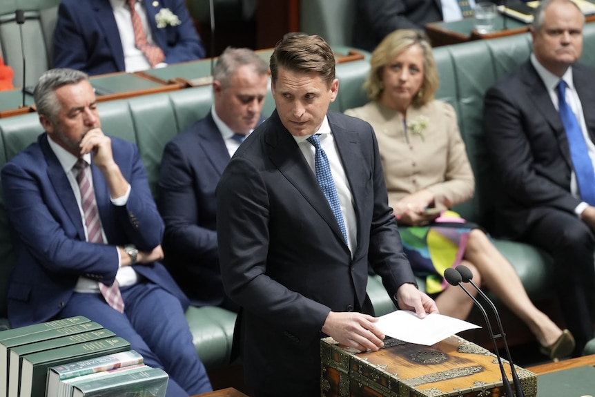 Liberal frontbencher Andrew Hastie looking serious as he speaks in Parliament about Helen Haines.