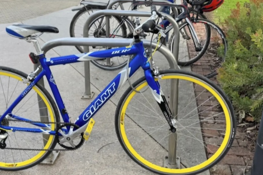 A bike at a bike rack.