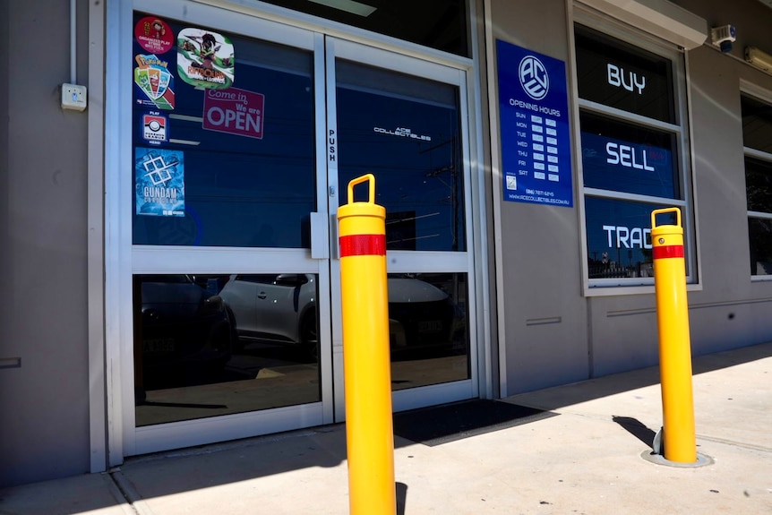 bollards outside the glass door of a shop
