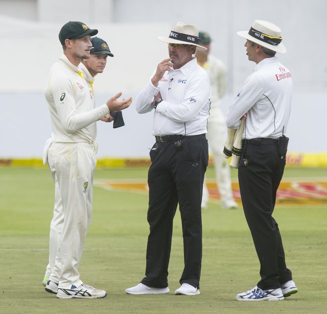 Umpires Nigel Llong and Richard Illingworth confronted Cameron Bancroft after he was caught on the big screen with sandpaper in his trousers. 