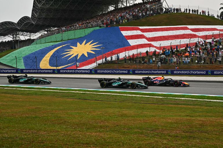 Red Bull Racing's Dutch driver Max Verstappen (R), Mercedes' Italian driver Kimi Antonelli (C) and Mercedes' British driver George Russell (L) steer their cars during the Formula One Bahrain Grand Prix in Sepang on October 4, 2026. (Photo by Lillian SUWANRUMPHA / AFP)