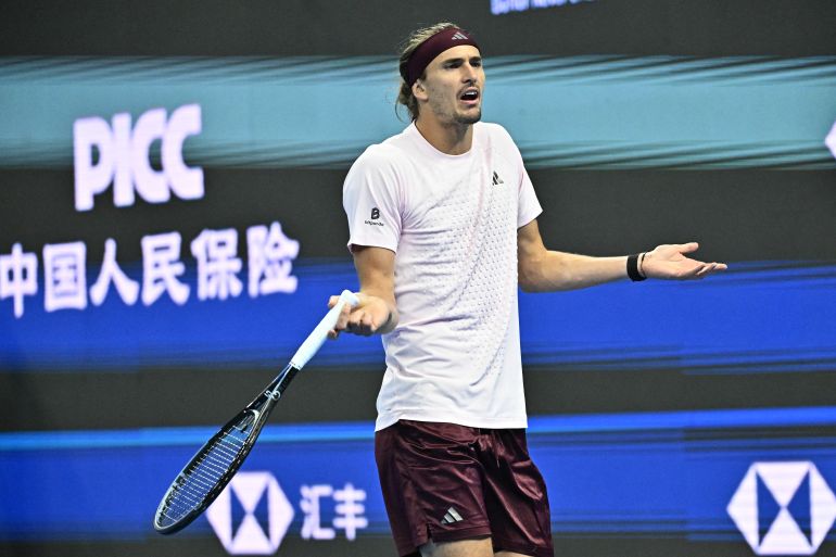 Germanys Alexander Zverev reacts during his mens singles quarter-final match against Serbia's Novak Djokovic at the China Open tennis tournament in Beijing on October 4, 2026. (Photo by Pedro PARDO / AFP)