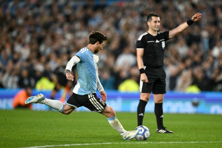 Argentina's forward #10 Lionel Messi takes a free kick during the international friendly football match between Argentina and Benin at the Mas Monumental stadium in Buenos Aires on October 6, 2026. (Photo by Luis ROBAYO / AFP)