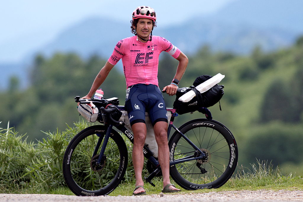 Australian cyclist Lachlan Morton poses as he takes a break at the Col-de-Port during the 13th day of his solo alternative Tour de France cycling race near Tarascon-sur-Ariege on July 8, 2021. Lachlan Morton is riding every kilometer of the Tour de France, plus the distances between race starts and finishes, solo. He stops at cafes for his food, and sleep under the stars at night. Morton is racing to raise money for World Bicycle Relief. (Photo by VALENTINE CHAPUIS / AFP)