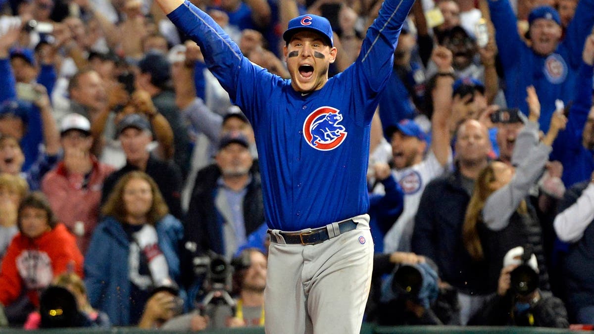 Anthony Rizzo celebrates after catching the final out at Progressive Field.