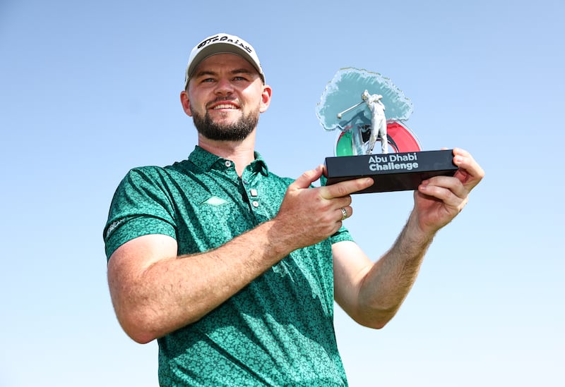 Liam Nolan of Ireland poses with the trophy following victory on day four of the Abu Dhabi Challenge at Al Ain. Photograph: Francois Nel/Getty