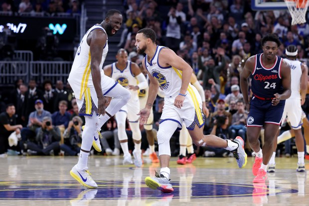 Draymond Green #23 reacts after Stephen Curry #30 of the Golden State Warriors made a basket against the LA Clippers in the fourth quarter at Chase Center on October 28, 2025 in San Francisco, California. NOTE TO USER: User expressly acknowledges and agrees that, by downloading and/or using this photograph, user is consenting to the terms and conditions of the Getty Images License Agreement. (Photo by Ezra Shaw/Getty Images)
