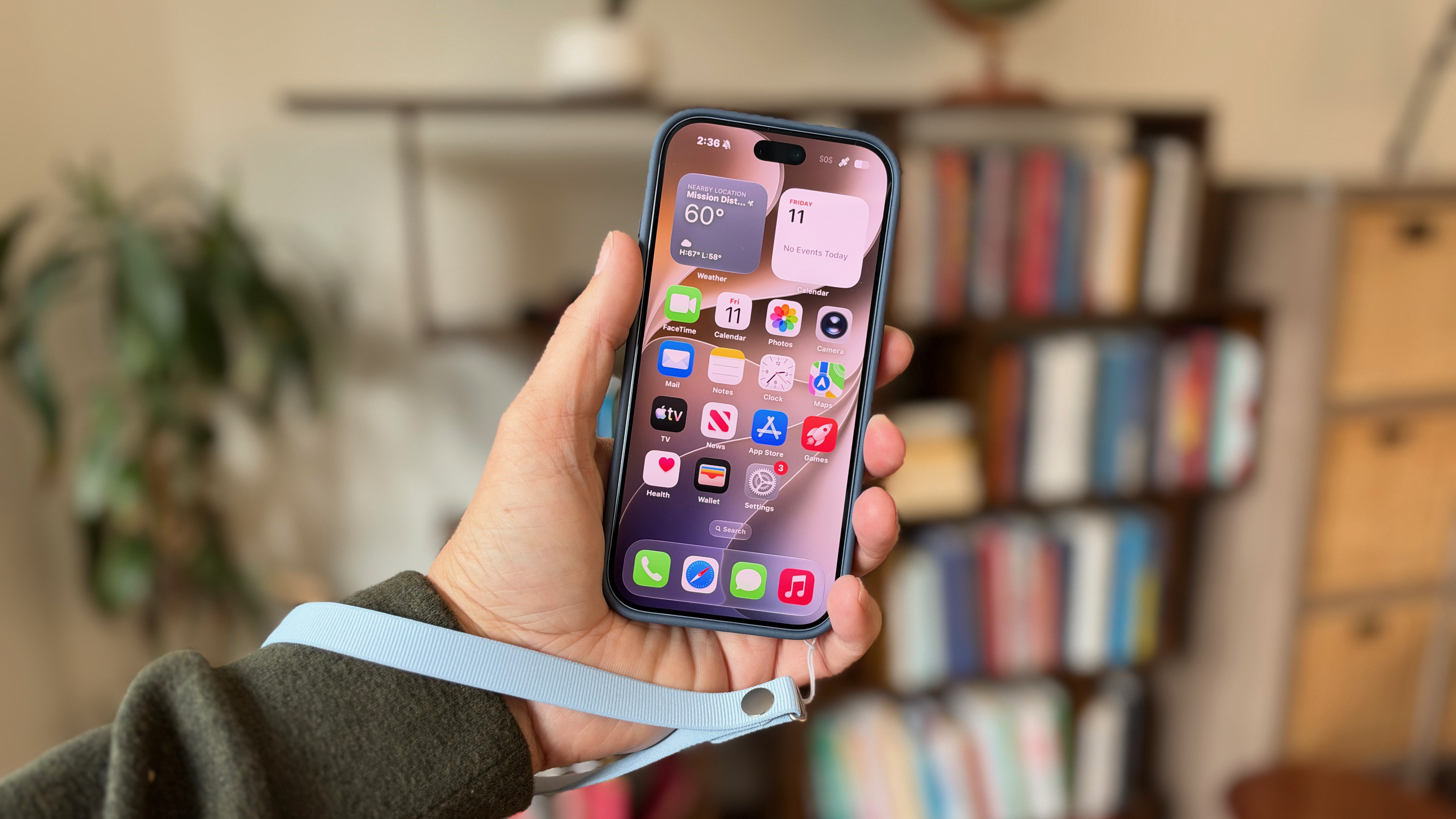 A hand holding the iPhone 18 Pro in a case