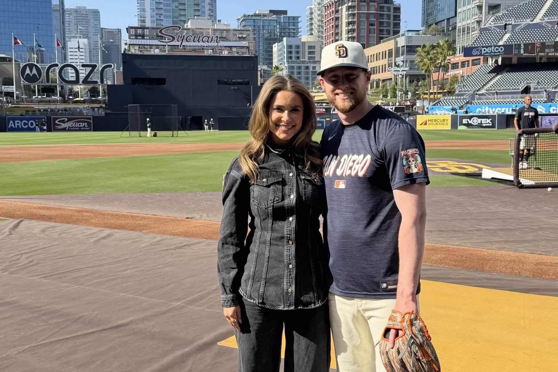 White Sox TV reporter Brooke Fletcher and Padres second baseman Jake Cronenworth pose on the field in San Diego.