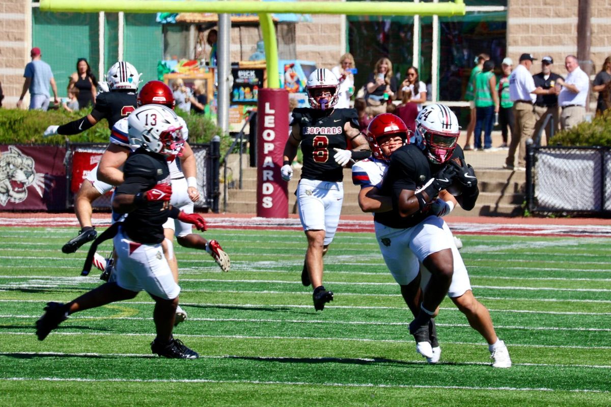 Sophomore running back Cam Azodeh returning a punt against the University of Richmond on Saturday.
