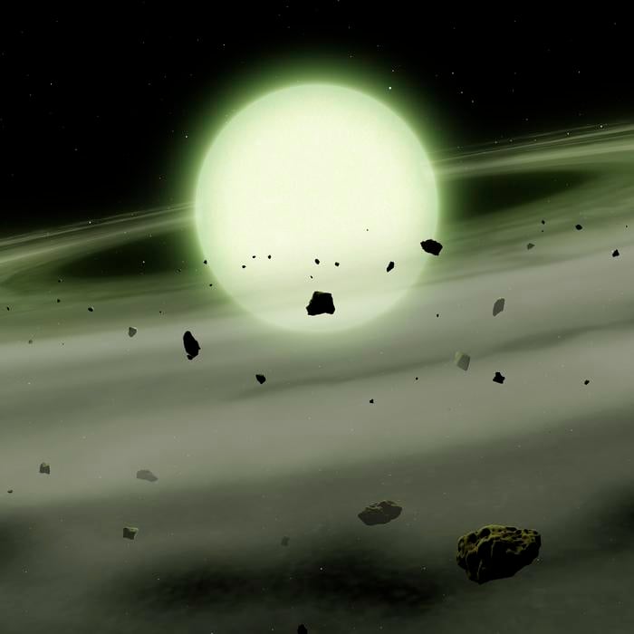 Artist’s illustration of a white dwarf appearing greenish from the sodium-rich planetary debris that enriches its atmosphere. (Credit: Mark A Garlick/University of Warwick)