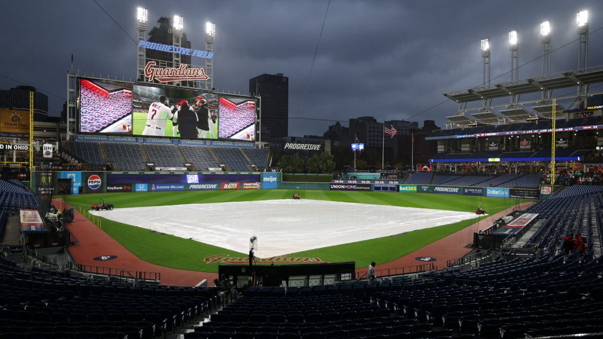 Tarp covers the field at Progressive Field in Cleveland, Ohio