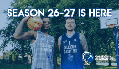 2 basketball players looking at camera